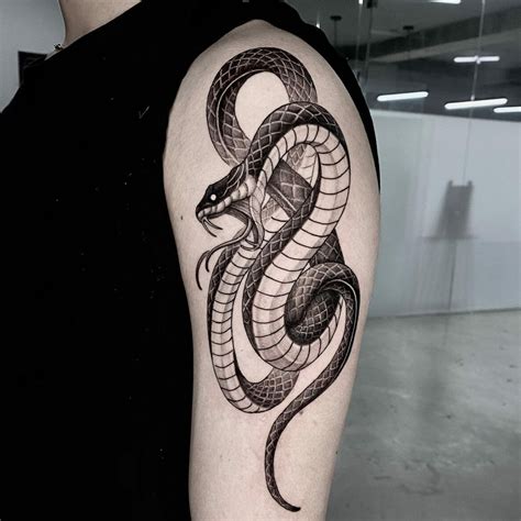 upper arm snake tattoo